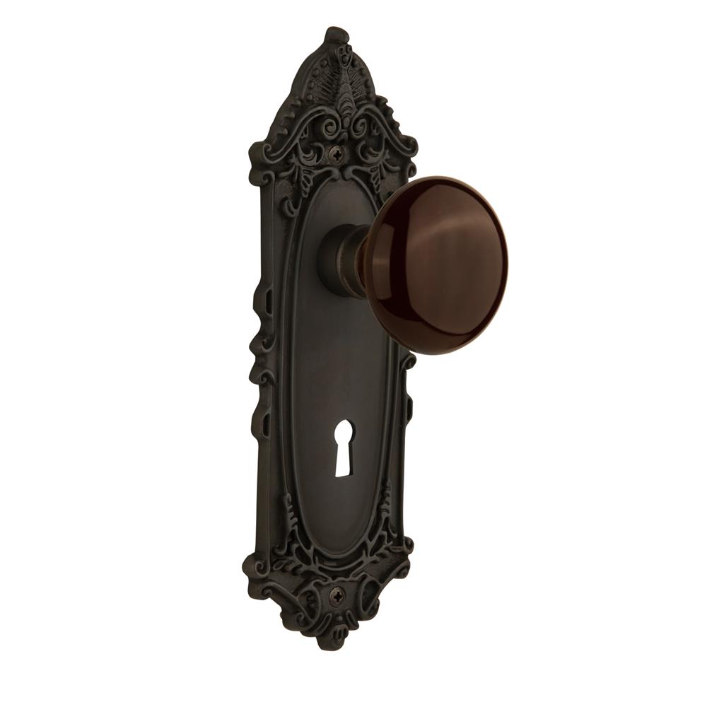 Nostalgic Warehouse VICBRN Single Dummy Victorian Plate with Brown Porcelain Knob with Keyhole in Oil Rubbed Bronze